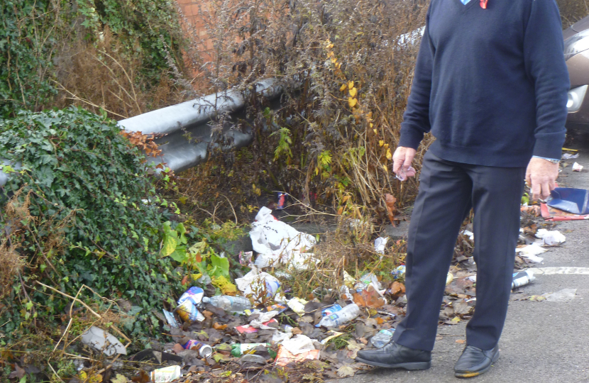 Bob by the rubbish that has been dumped in the Car Park
