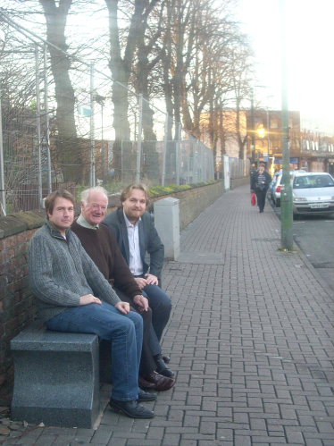 Gareth, Bob and Robert siting on a bench outside St Barnabas Church, Erdington