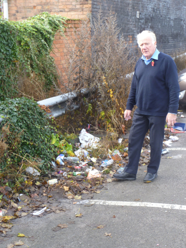 Bob by the rubbish that has been dumped in the Car Park