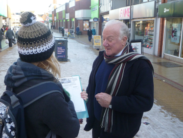 Bob with local resident who is signing the petition to save the Walk in Centre